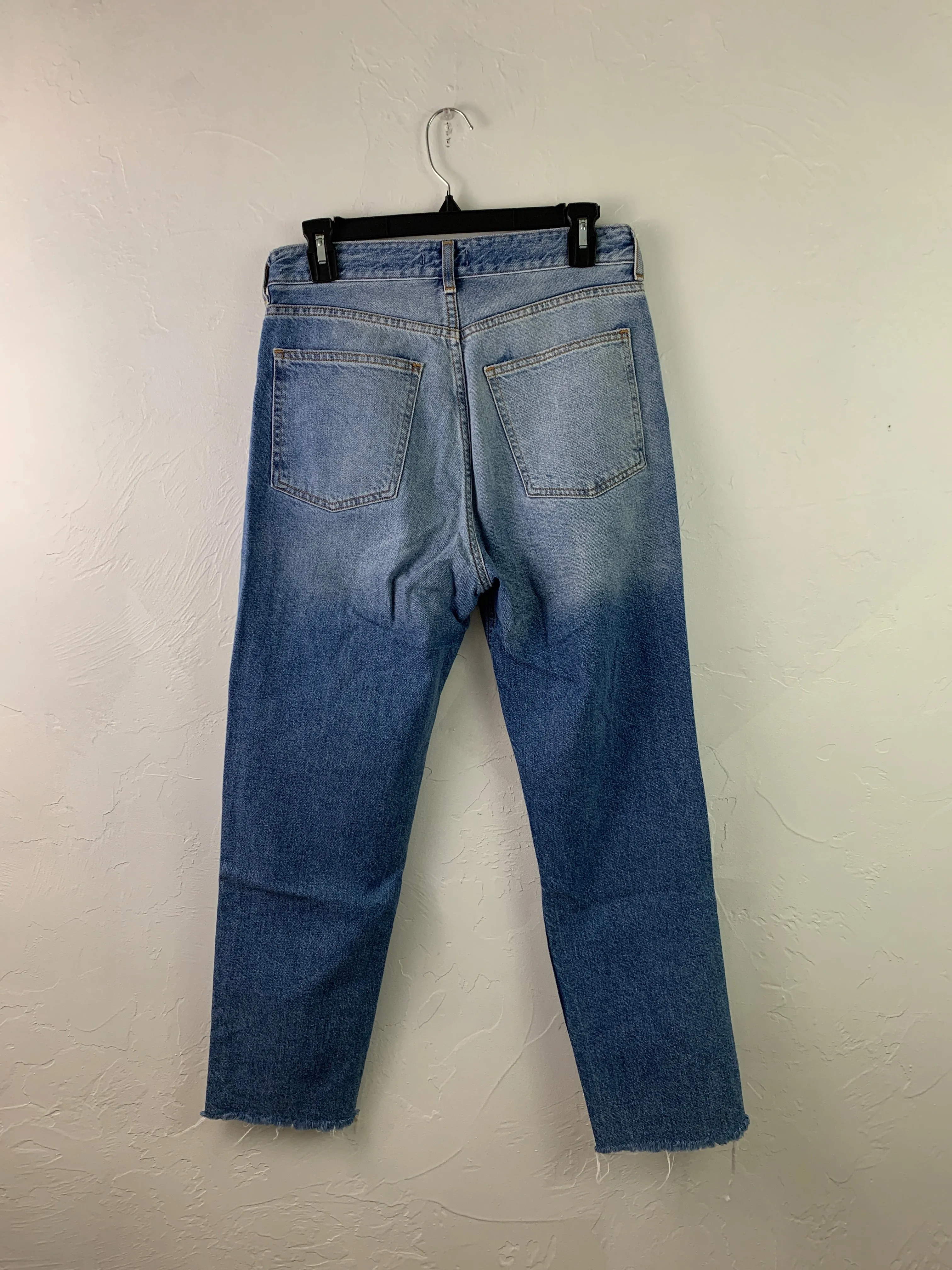 Distressed medium wash denim