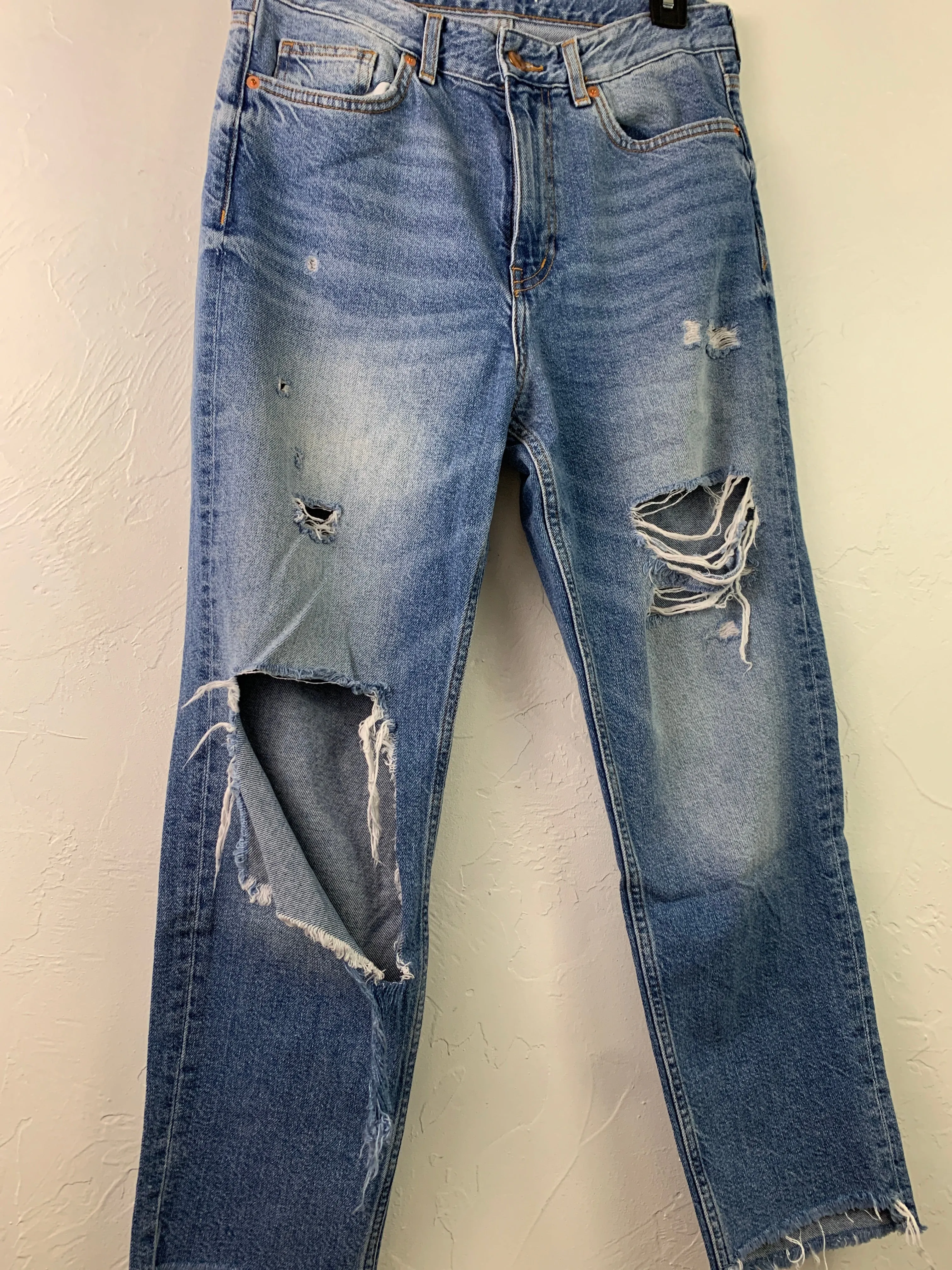 Distressed medium wash denim